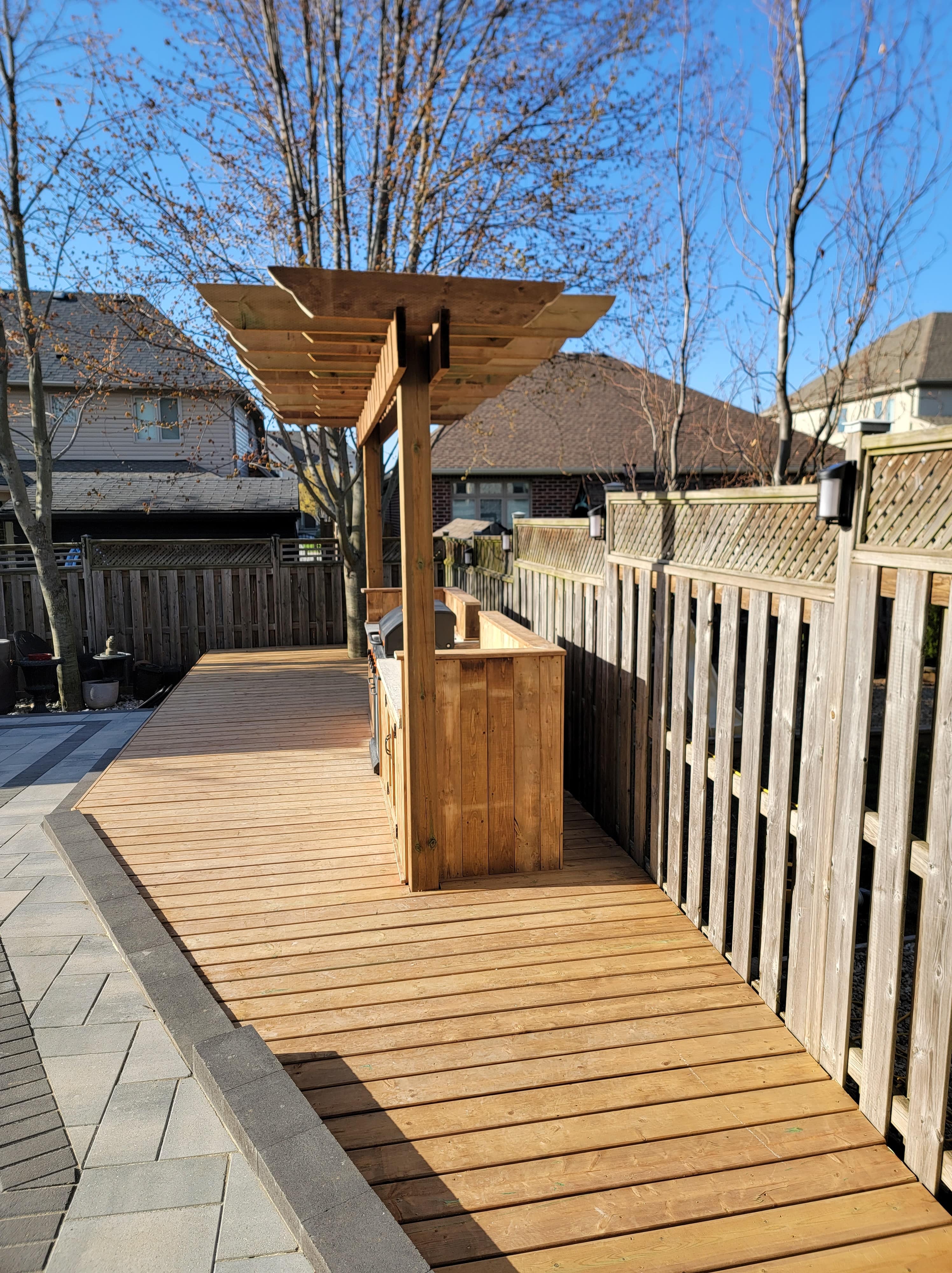 Contemporary outdoor kitchen with integrated storage and prep area